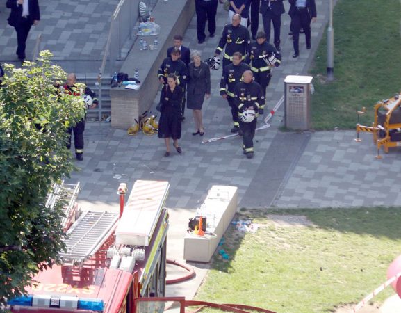 Britain's Prime Minister, Theresa May, visits the scene of a tower block which was destroyed in a fire disaster, in north Kensington, West London, Britain June 15, 2017. REUTERS/Peter Nicholls