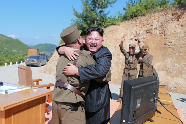 FILE PHOTO: North Korean leader Kim Jong Un reacts with scientists and technicians of the DPRK Academy of Defence Science after the test-launch of the intercontinental ballistic missile Hwasong-14 in this undated photo released by North Korea's Korean Central News Agency (KCNA) in Pyongyang July, 5, 2017. KCNA/via REUTERS/File Photo ATTENTION EDITORS - THIS IMAGE WAS PROVIDED BY A THIRD PARTY. REUTERS IS UNABLE TO INDEPENDENTLY VERIFY THIS IMAGE. NO THIRD PARTY SALES. SOUTH KOREA OUT.